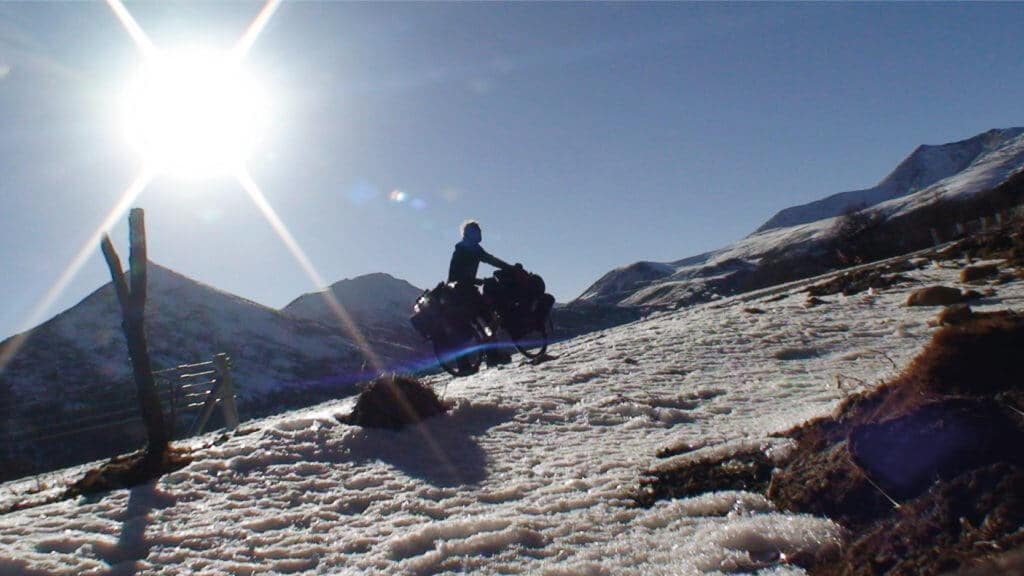 Pushing my bicycle up a mountain in Tibet