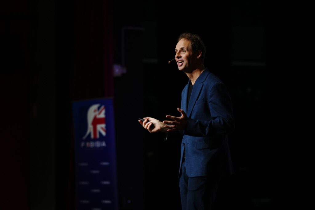 Rob Lilwall speaking on stage